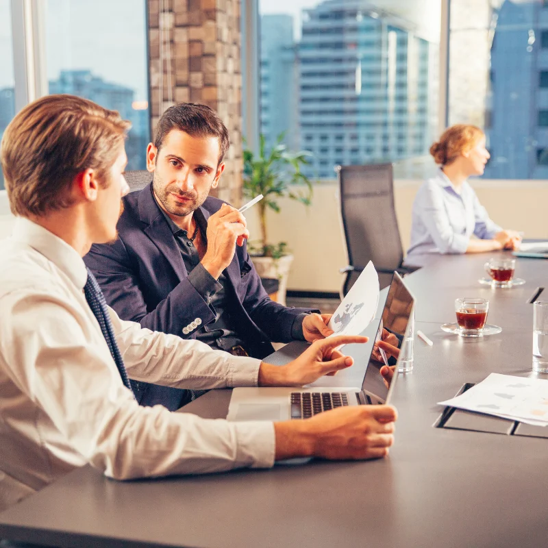 Business team discussing website development and digital solutions strategy in office meeting