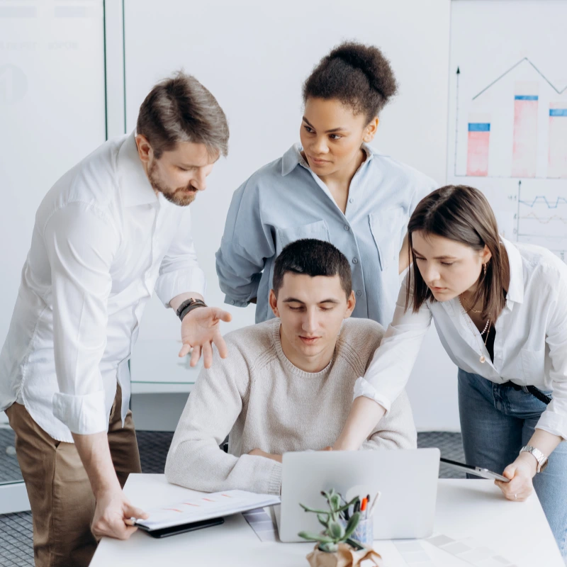 Professional web development team discussing website design and digital marketing strategy at N & T Infotech Surat.